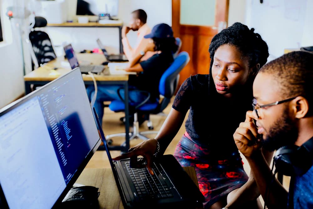 Two people learning together at a computer